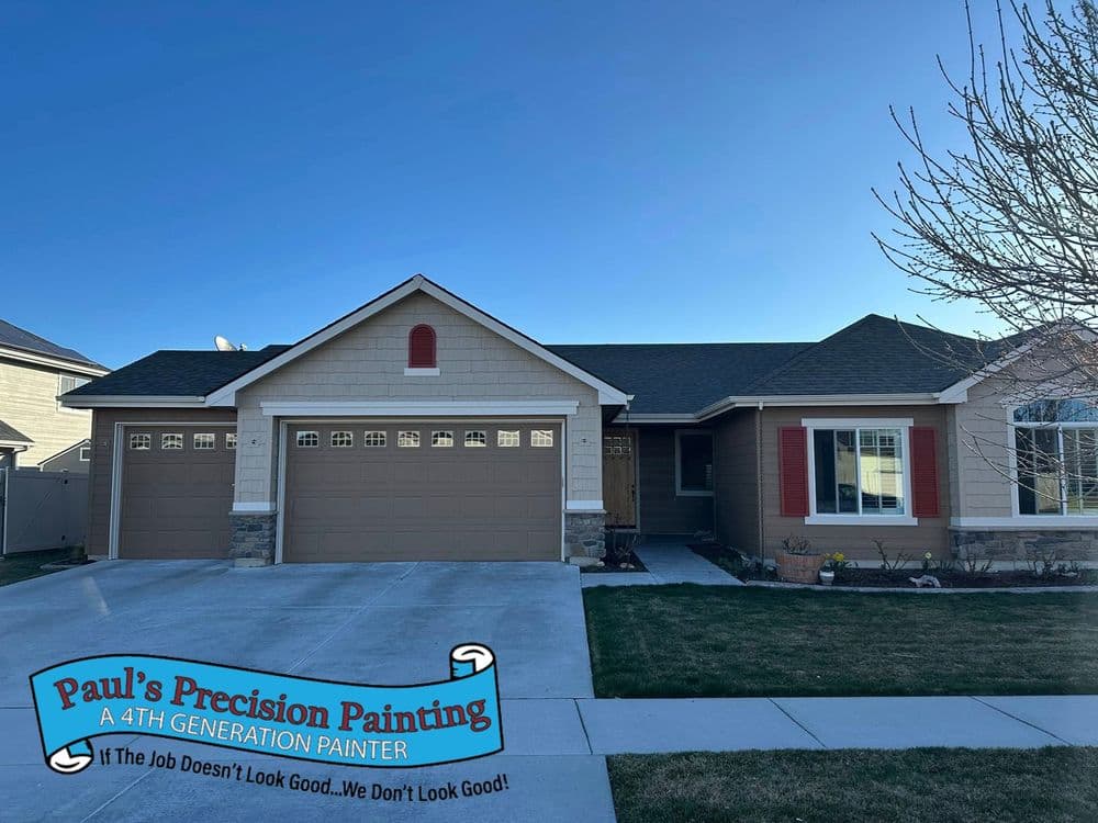 Residential home exterior with professional painting by Paul's Precision Painting.